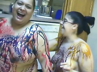 BBW lesbian girls gets messy in chocolate syrup..