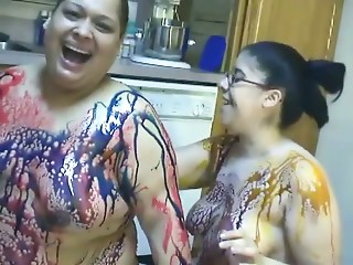 BBW lesbian girls gets messy in chocolate syrup..