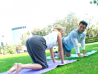 Chubby blonde bitch practices yoga in park with..