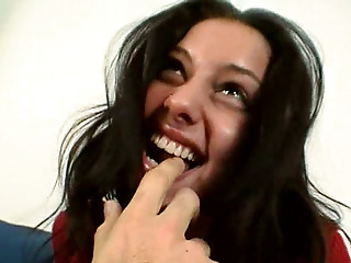 Beautiful brunette girl is giving a head in a..