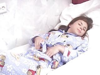 Cute teen inserts a dildo in her tight pussy