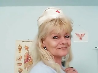 Aged blond lady shows off natural tits and dildo..